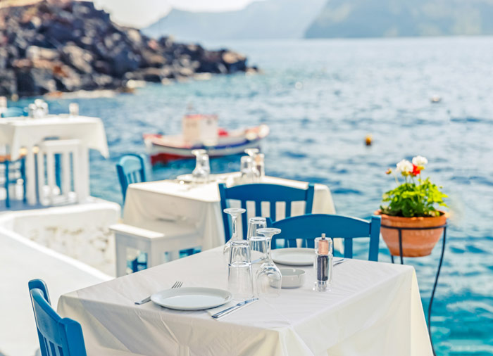 Seafront restaurant – Santorini island, Greek island honeymoon packages with Travelive