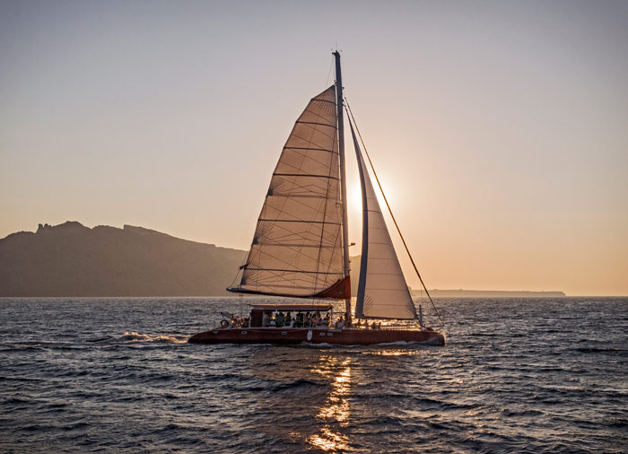Catamaran sunset cruise – Santorini honeymoon tour with Travelive, luxury travel agency