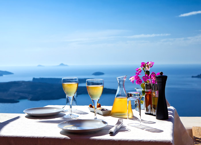 Table Overlooking Sea – romantic dinner Santorini, Athens Mykonos Santorini with Travelive